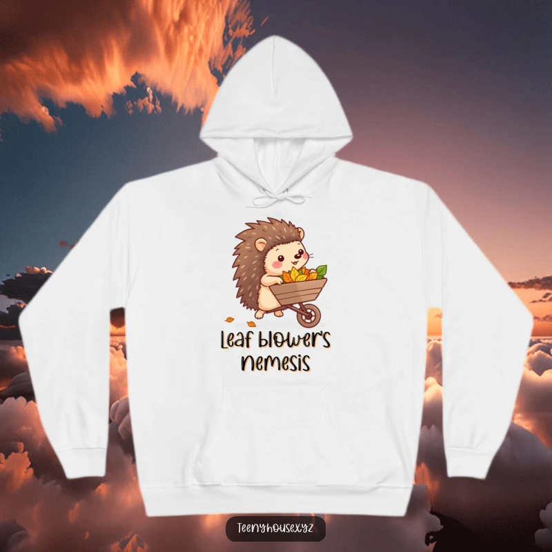 Funny Hedgehog Wheelbarrow Hoodie: A happy hedgehog gardener rolling a miniature wheelbarrow full of vibrant leaves, showcasing playful enthusiasm.